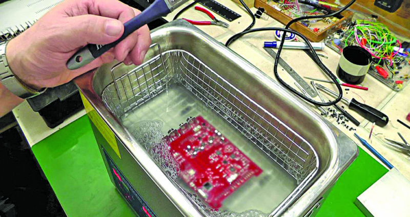 Removal of flux from printed circuit board using an ultrasonic cleaner