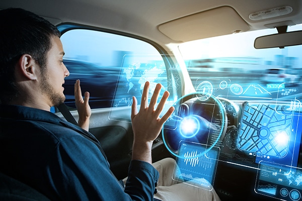 Young man riding autonomous car